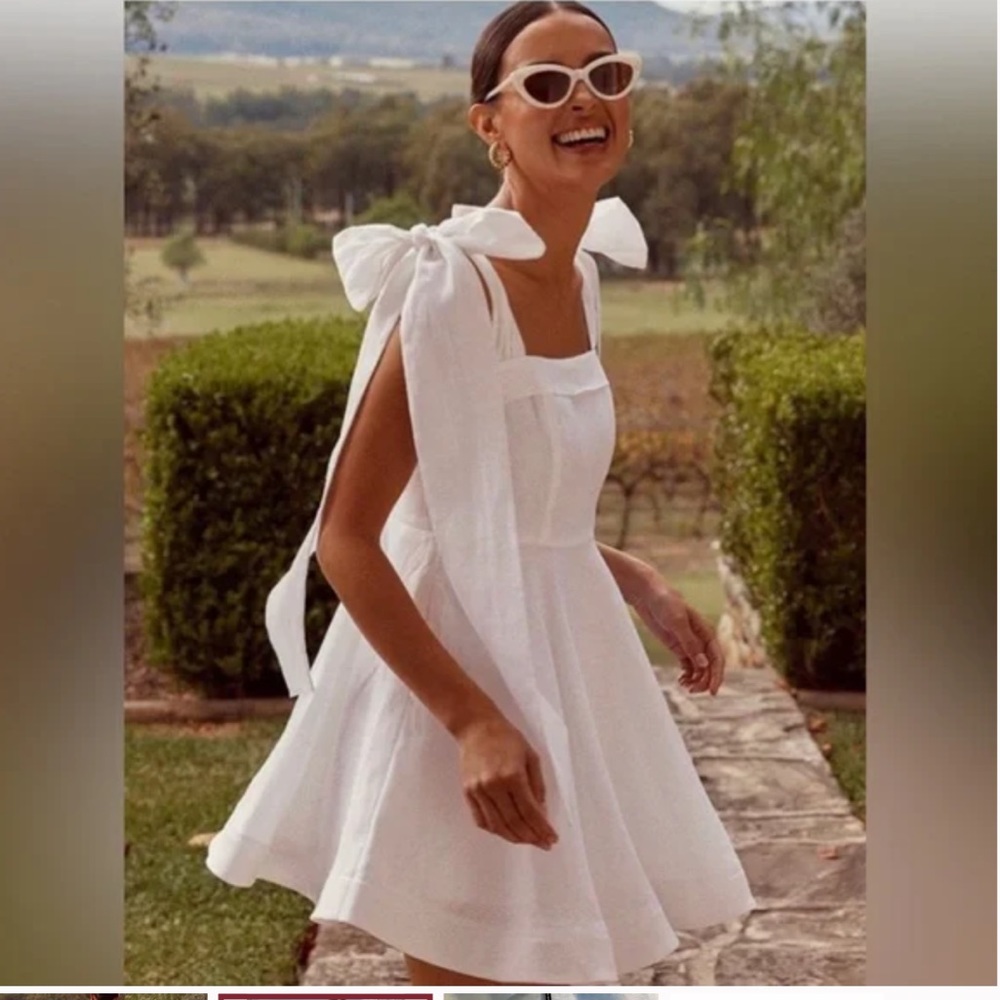 COPY - Dissh aisle of white mini dress with shoulder ties. Worn once.